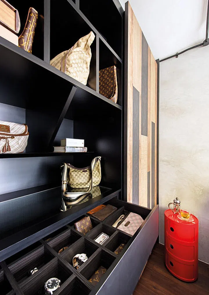 A patchwork of three bold-grained wood laminate panels on the wardrobe doors gives the bedroom an earthy, homely feel.