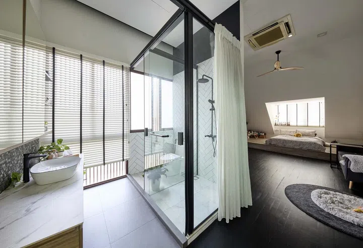 All of the three daughters' bathrooms in interior designer Cheryl Gay of Coterie Design's 3,600 sq ft semi-detached home in Yio Chu Kang follow a consistent black and white design theme.