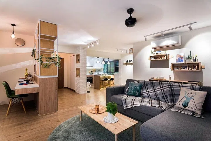 Taking advantage of the space available next to the bomb shelter, a study nook was created and tucked cosily at this corner. This way, it allows more space for the adjacent living room too. Interior design by FIneline.
