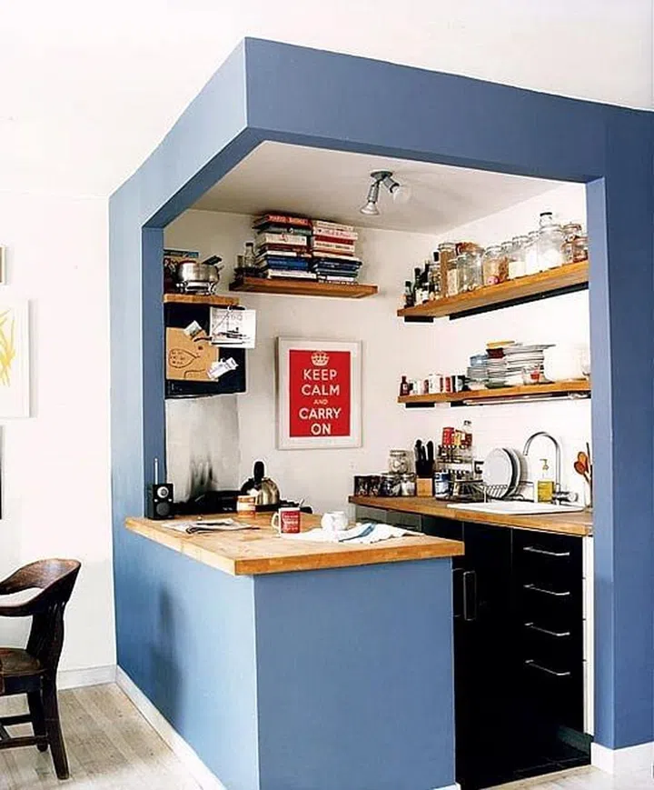 Why not create a little kitchen nook in your home? Not only is the compact space perfect for small homes, it still offers a view into the cooking station and is a cheerful addition to any space.