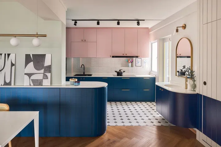 An open-concept kitchen lets the adults in the family go about their tasks and stay connected to the kids in this 1,592 sq ft HDB executive apartment in Queenstown.