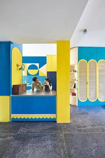 Homeowners Sauman Mahata, a technology consultant in a global technology consultancy, and Gisela Sim, an associate project director in a creative advertising agency strike a pose in their 2-bedroom walk-up apartment along East Coast Road where they live with their 2 cats.