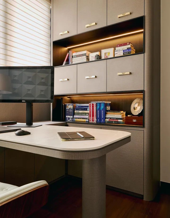 Custom shelving and a multifunctional desk double as both study and dressing table.