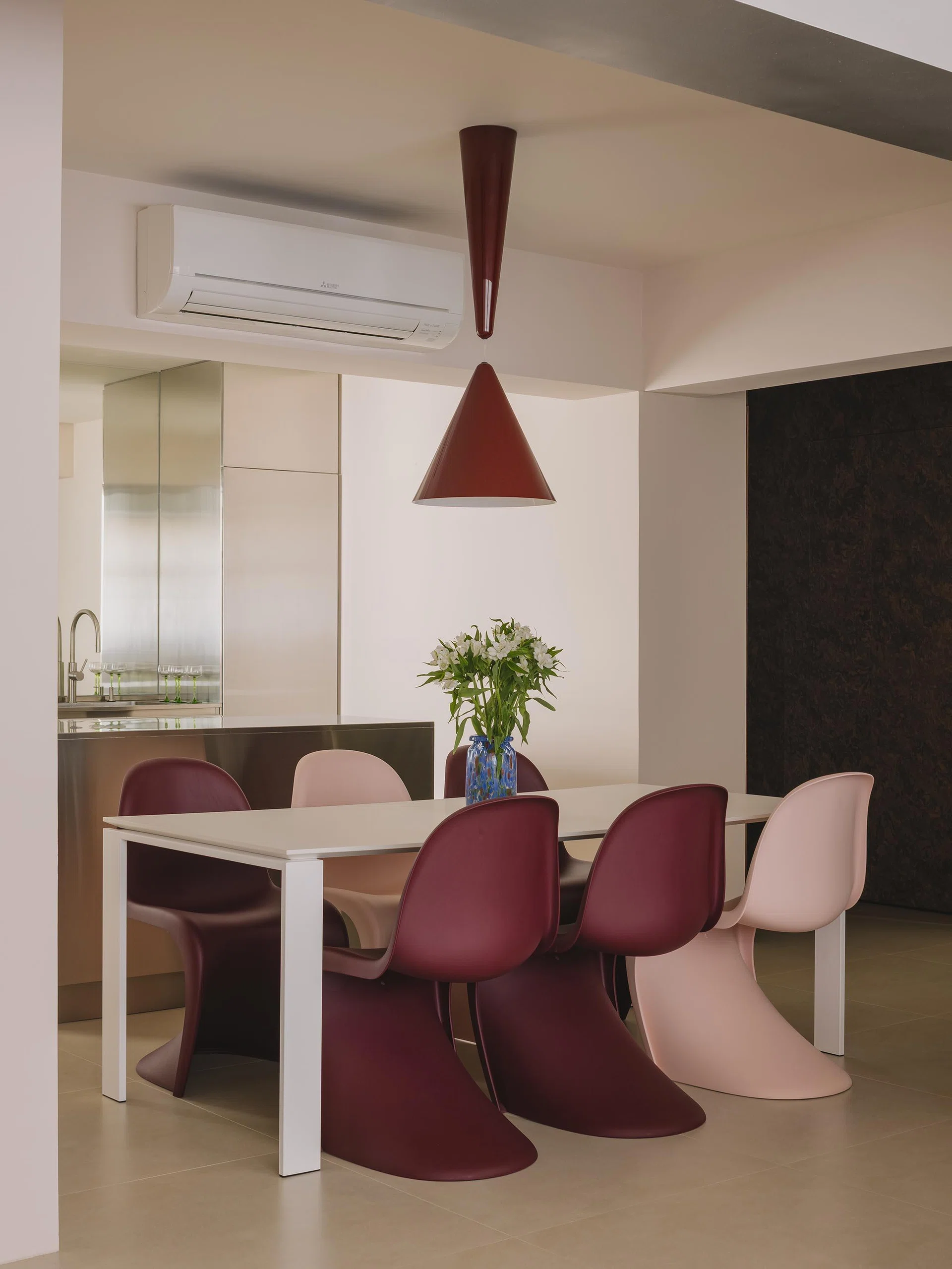 In front of the kitchen island is the dining area, which then flows into the living room.