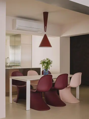 In front of the kitchen island is the dining area, which then flows into the living room.