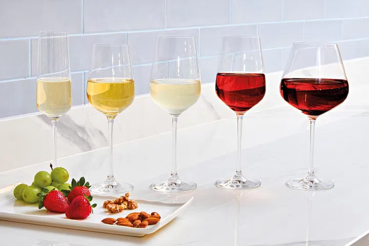 From left, wine glasses for Champagne Flute, Sweet Wine, Light White Wine, Rose or Spicy Red Wine, Light-Bodied Red Wine