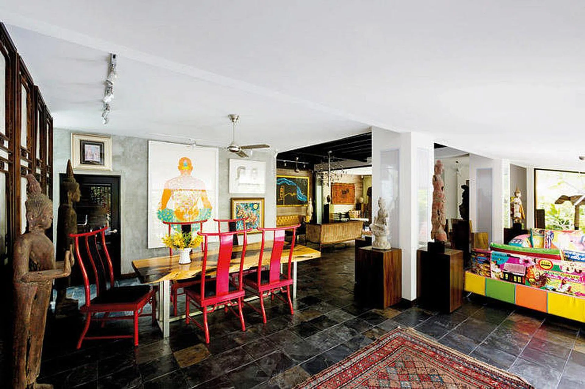 This double storey Balinese-style home to an art collector couple is a mix of tropical and edgy – the setting is predominantly Balinese, while the furniture and art is ultra modern. Interior design by Edgeline Planners.