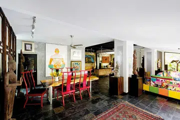 This double storey Balinese-style home to an art collector couple is a mix of tropical and edgy – the setting is predominantly Balinese, while the furniture and art is ultra modern. Interior design by Edgeline Planners.