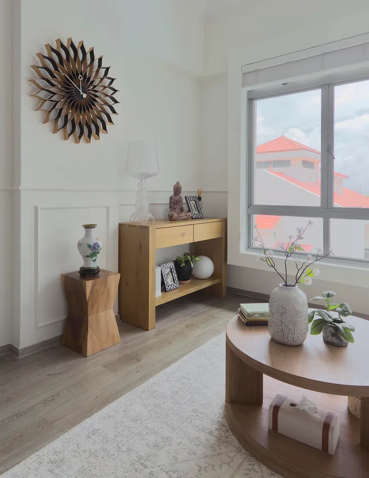 Wainscoting (Miga Korean from DeKorea) wraps around the living room walls — a popular look in Hamptons-inspired homes. 