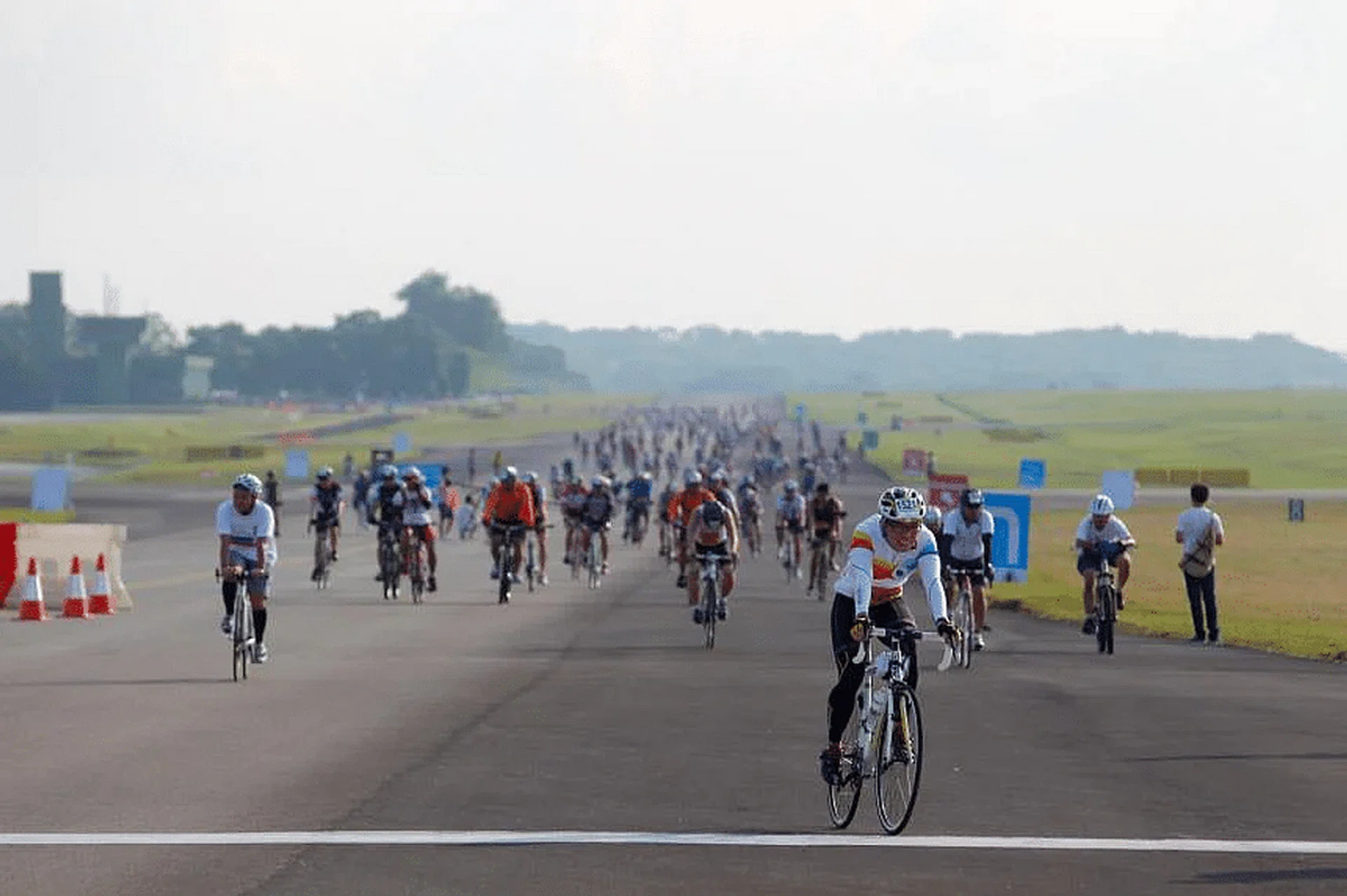 Participants cycling down the runway of Paya Lebar Airbase during the National Runway Cycling and Skating event in 2012. PHOTO: ST FILE