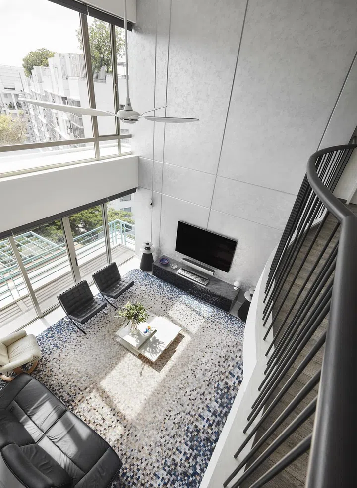 Top down view of the double volume living room in a 2-storey penthouse in Bukit Timah.