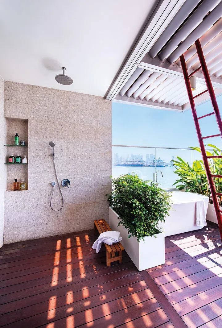 A roof keeps the shower safe from the elements and yet maintains the openness of an outdoor facility.