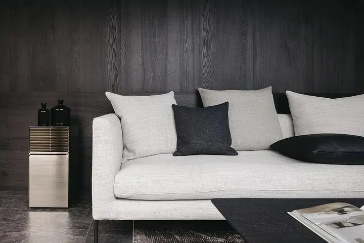 The furniture’s clean lines continue the sleek visual language that defines this bachelor pad.