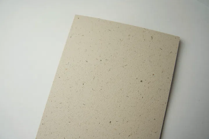 Universal interprets recycled and composite surfaces through a refined composition of small fragments that reveal themselves gradually, creating texture and depth without visual noise and lending itself naturally to enduring interiors.