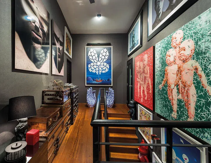 The staircase landing on the upper floor is designed to look like an art gallery, and is the homeowner's favourite space.