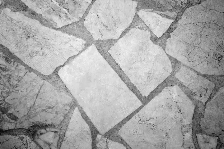 A stunning mosaic of stone tiles creates an intricate pattern on the ground.