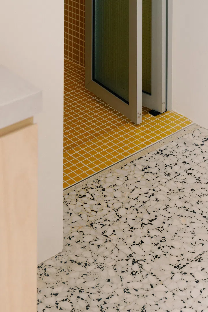 The original terrazzo lighting was preserved and carries throughout the home.