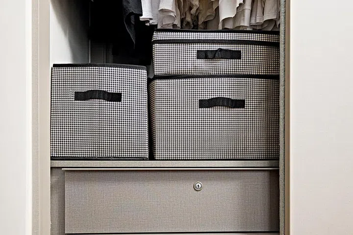 Grey storage box with handle, all from Daiso.