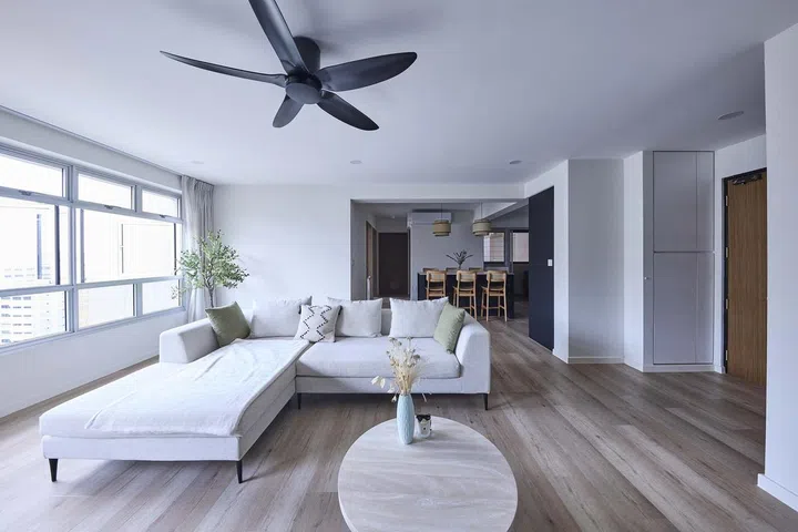 Shaker-style television console, cabinets and shelves in the living room not only reflect the farmhouse theme, but also factor in practical considerations for this 32-year-old male homeowner of a 5-room HDB flat in Tampines Avenue 8.