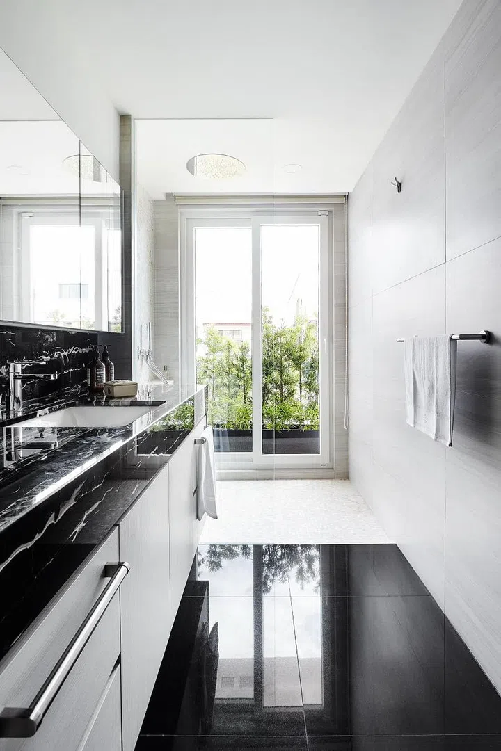 All black and white kitchen in 3 Lor L Telok Kurau designed by Collective Designs.