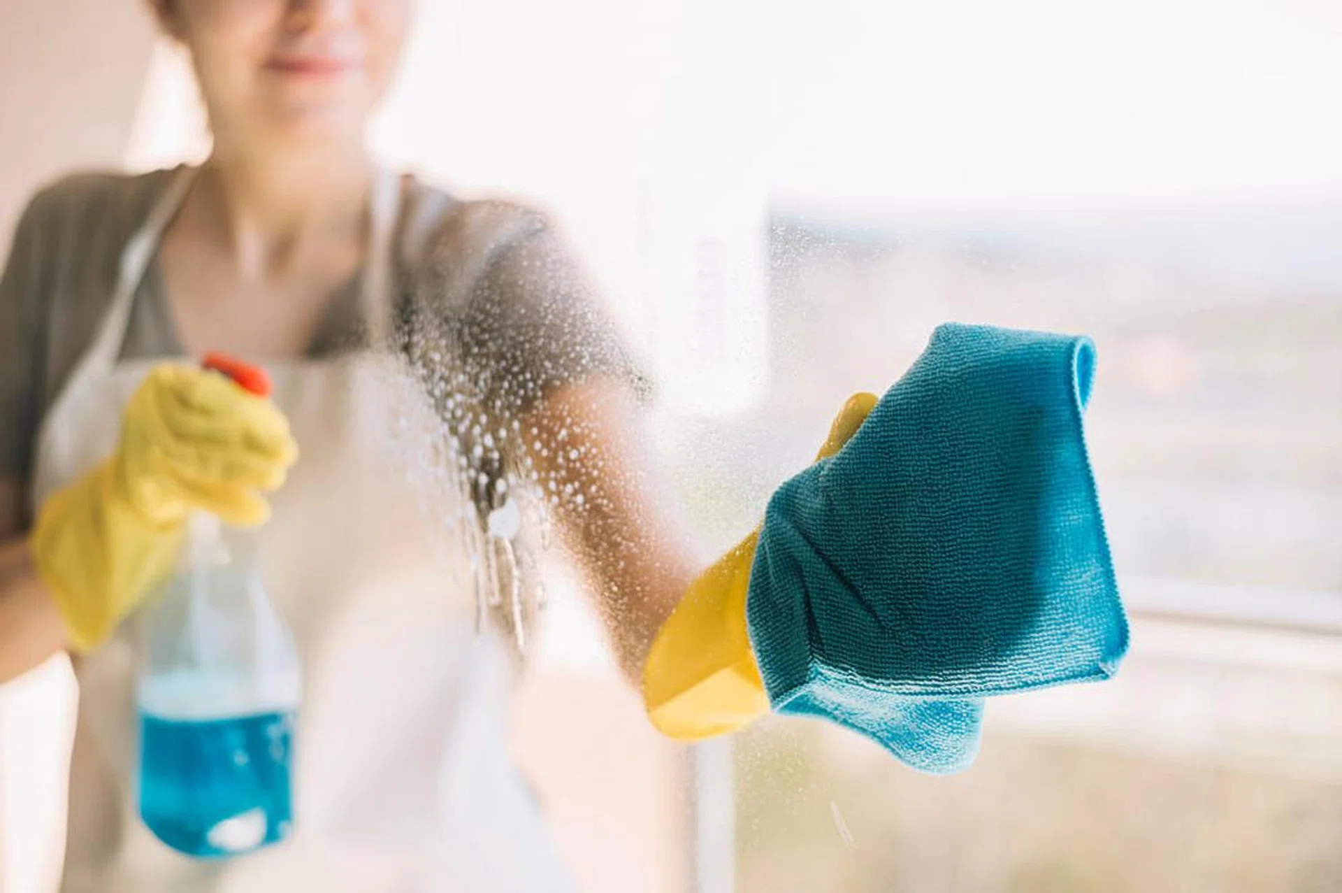 Urban Company woman cleaning glass