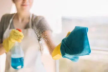 Urban Company woman cleaning glass