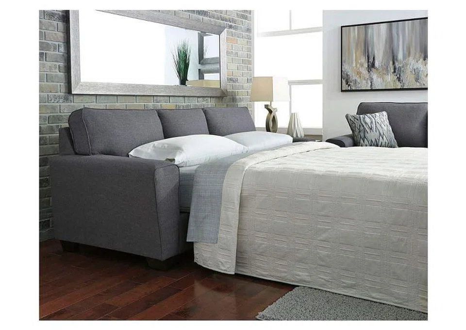 Ashley Furniture Calion Queen Sofa Sleeper (RRP: $2,099). Sofa Dimension: L221 X D96.5 x H96.5 cm. Mattress Size: W152 x D182 x H108 cmHigh-resiliency foam cushions wrapped in thick poly fiber. 4 decorative pillows included. Polyester upholstery and pillows with soft polyfill. Exposed feet with faux wood finishIncluded bi-fold queen memory foam mattress sits atop a supportive steel frame. Memory foam provides better airflow for a cooler night’s sleep. Memory foam encased in damask ticking.