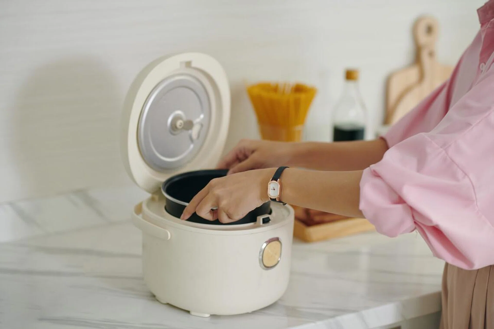 Woman Using Multicooker To Cook Healthy Food