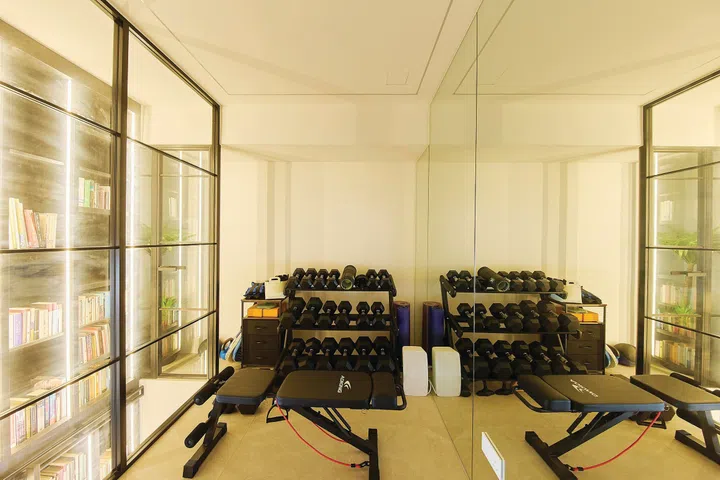 Home gym in a 3-bedroom condo (1,800 sq ft) in Pandan Valley, designed by Insight.Out Studio.