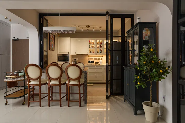 When opened, the bifold doors turn the kitchen into an inviting social space.