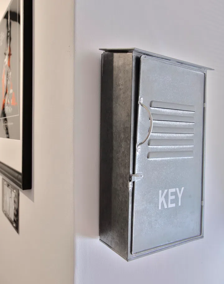 A stainless steel key box, adorning the wall between the music station and gym, adds to the industrial-esque aesthetics. 
