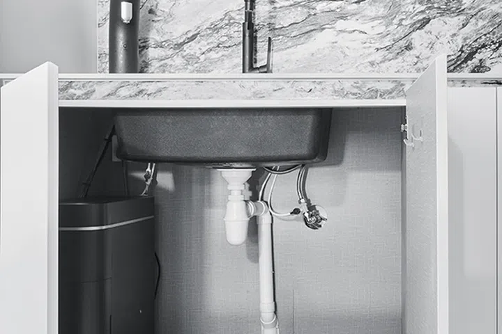 Under sink storage before storage shelves and boxes were introduced.