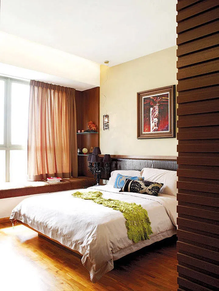 Warm, earthy, and woody master bedroom in a 800 sq ft black and white-themed 2-bedroom condo.
