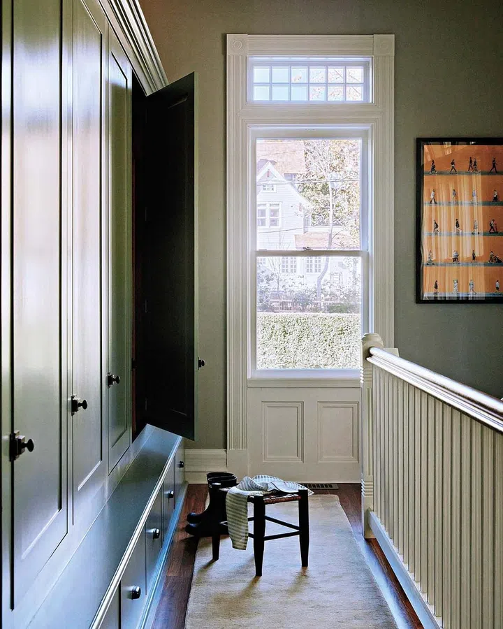 The cabinets are painted in Templeton Gray by Benjamin Moore, the pulls are by Rejuvenation and the vintage runner is from Etsy.