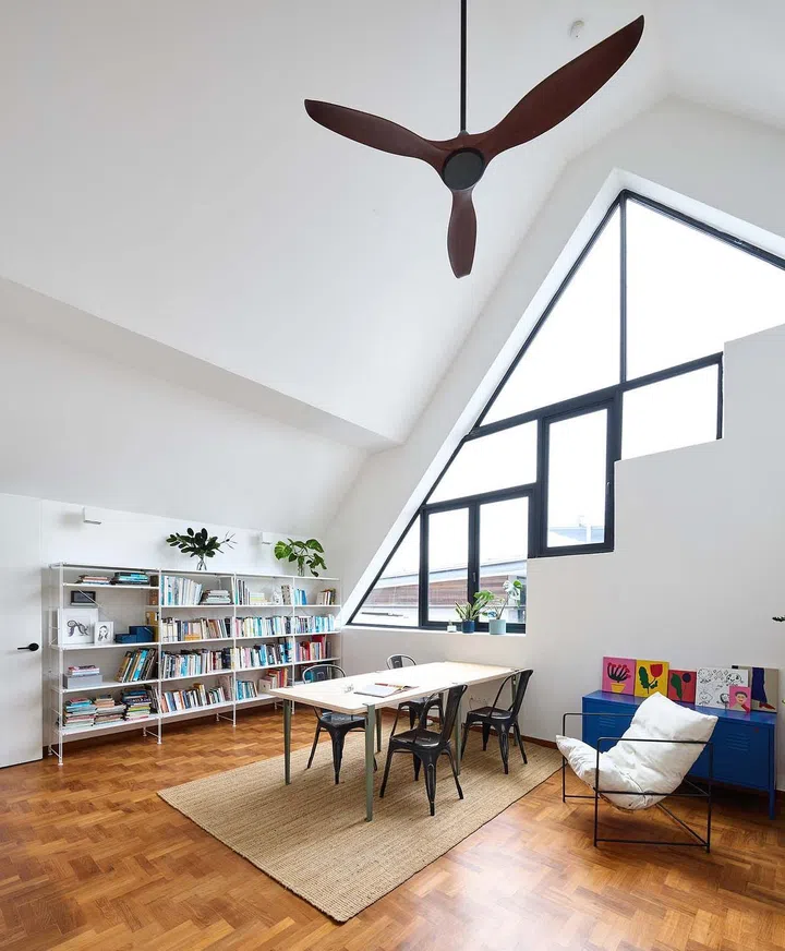 The attic serves as a work loft in this 3,990 sq ft semi-detached home at Frankel Estate.