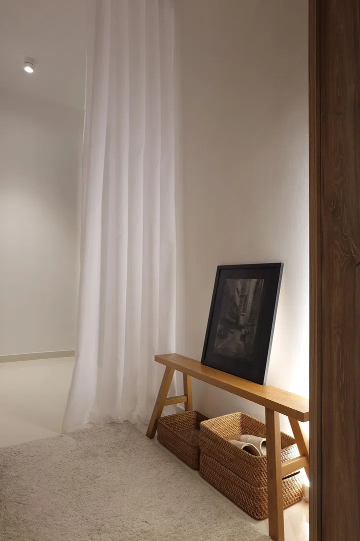 Sheer curtains were introduced to soften the space. They demarcate spaces and provide privacy when needed.