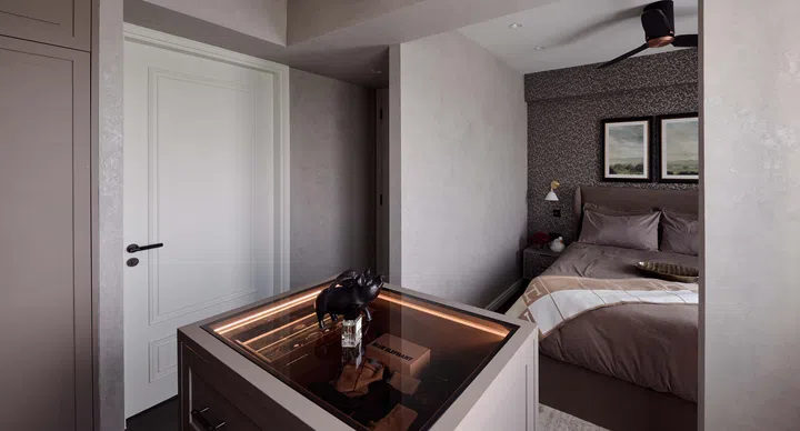 Jason’s bedroom includes a stylish display shelf, perfect for showcasing his watch and bag collection.