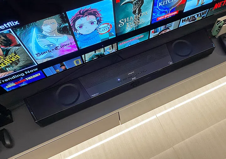 Creative SXFI soundbar placed against a TV