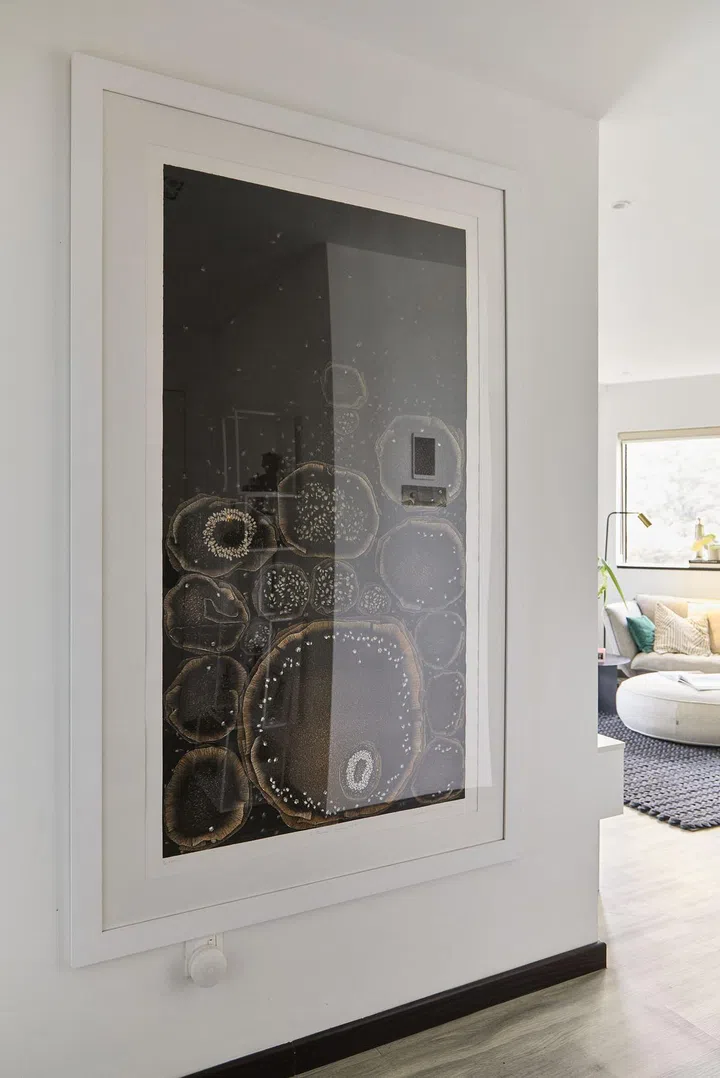 Framed artwork hanging on the wall in this 1,080 sq ft 2-bedroom Bayshore Park condo.