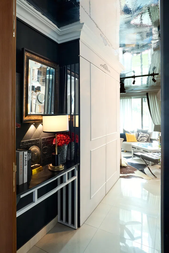 A welcoming entrance foyer in this 5-room HDB DBSS flat in Ang Mo Kio.