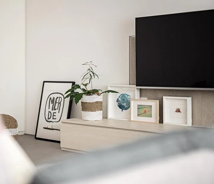The television feature wall and console play up different textures and materials.