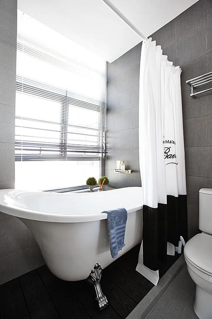 The wife had her heart set on a clawfoot bathtub, so they found one that fit into the shower space.