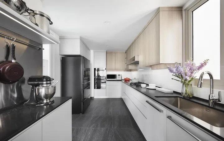 Air conditioned, galley-style kitchen in this 2-storey penthouse in Bukit Timah.