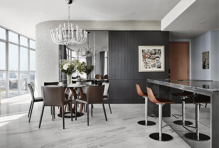 Hidden behind the veneered surface here are storage cabinets. Placing one of the children’s artworks here is a fun touch.