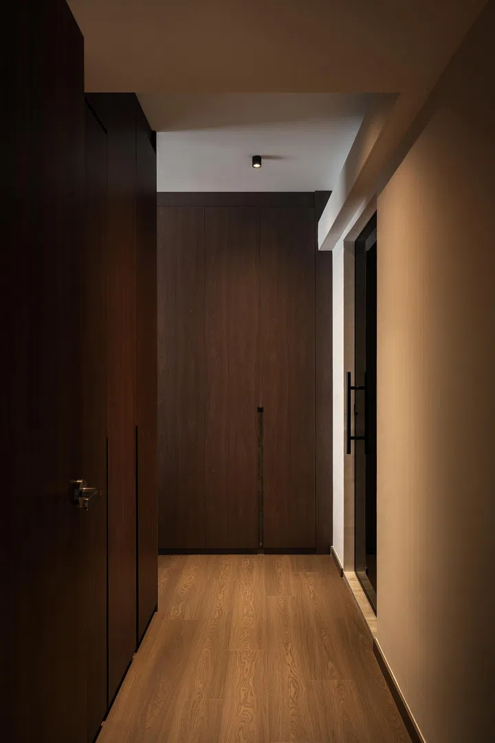 Walk-in wardrobe in the master bedroom in a 5-room HDB BTO at Tampines Street 96 (1,216 sq ft), designed by Inizio Atelier.