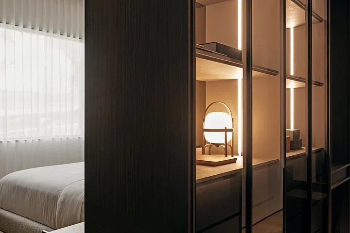 An apartment by Joey Khu Interior Design is used as a wall divider.