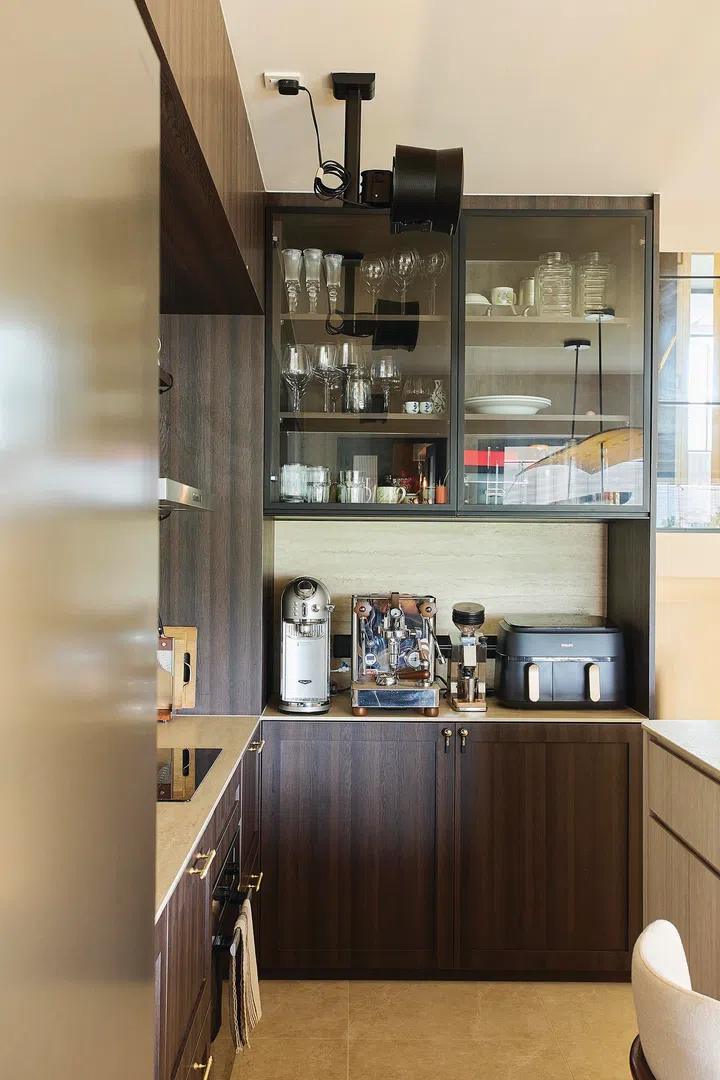 Dark laminate kitchen cabinets in a 3-bedroom condo (1,800 sq ft) in Pandan Valley, designed by Insight.Out Studio.