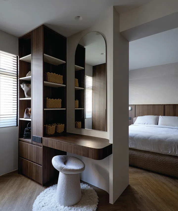 A sleek vanity counter sits just outside the master bedroom, thoughtfully designed for convenience.