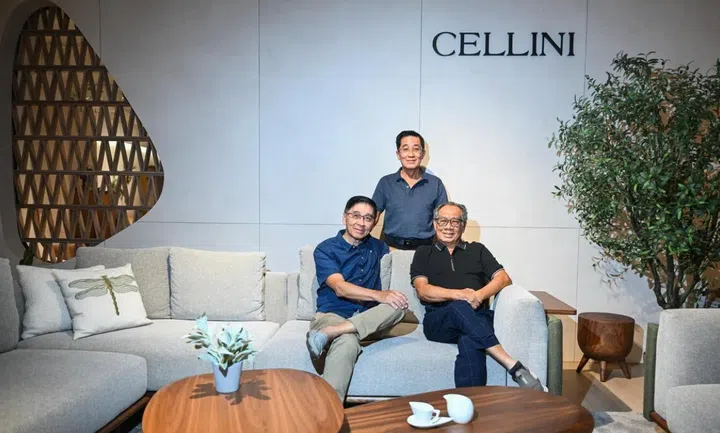 Cellini founder Tan Cheng Whatt (seated, right) with his younger brothers Jimmy Tan (seated, left) and Tan Cheng Liang (standing), who have worked alongside him since the brand’s inception 40 years ago. They are grouped around Cellini’s Celadon modular fabric sofa.