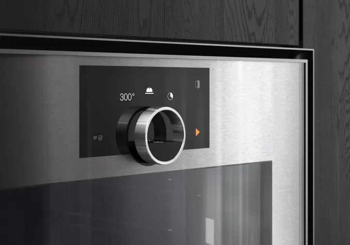 Gaggenau redesigned their iconic twin knobs into a single floating stainless steel ring.